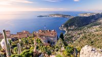 Scenic view of the Mediterranean coastline and medieval houses from the top of the town of Eze village on the French Riviera